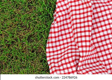 checkered plaid for picnic on green grass