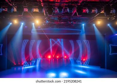 Checkered scene with laser beams, lamps and swirling smoke, disco dancing area interior - Shutterstock ID 2195208241