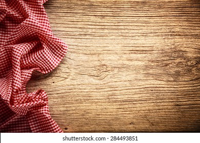 Checkered Tablecloth On Wooden Table