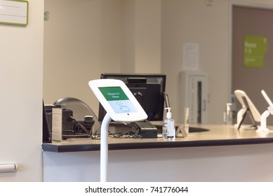 Check-in Kiosk Tablet Upon Arrival At Front Desk Of Test Center For Diagnostic Testing, Medical.