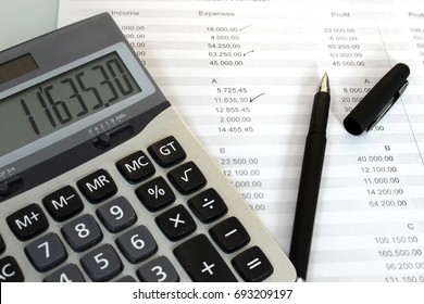 Checking the Accounts with calculator