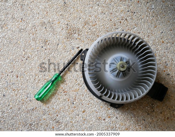 checking air blower fan motor of car at service\
station,car repair.
