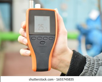 Checking The Air Condition With The Device. Measurement Of Air Temperature And Humidity. Part Of The Image Is Blurred.