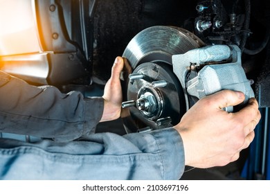 Checking the brake discs of a modern car. Vehicle braking system. - Powered by Shutterstock