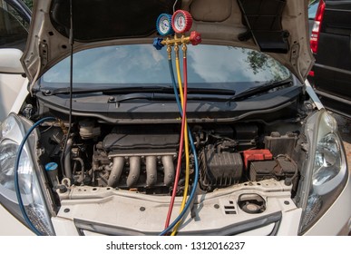 Checking Car Air Conditioning System: Refrigerant Recharge, Connecting Pipes For Freon Refill, Leak Detection By Manometer Gauge.