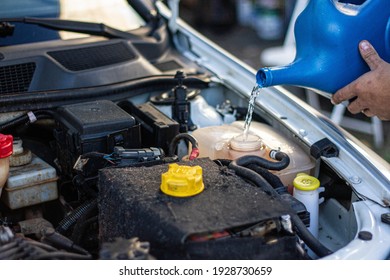 Checking Car Engine Oil And Water