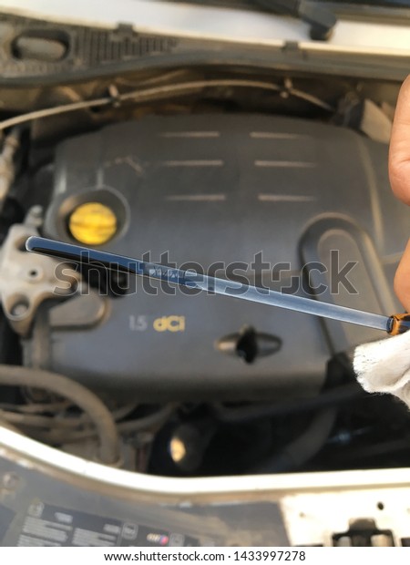 checking car oil engine in car service center,\
vehicle motor