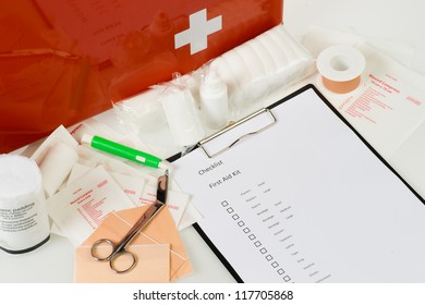 checking the content of a first aid kit - Powered by Shutterstock