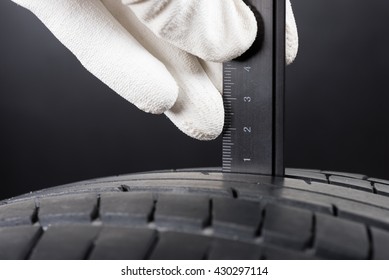 Checking The Depth Of Car Tire Tread