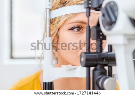 Checking eyesight with Slit lamp, examination of the eyes in an ophthalmology clinic