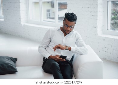 Checking How Much Time Left Until The End Of The Break. Stylish Afro American Guy In Classic Wear And Glasses.