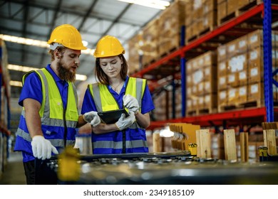 checking and inspecting metal machine part items for shipping. male and woman worker checking the store factory. industry factory warehouse. The warehouse of spare part for machinery and vehicles. - Powered by Shutterstock