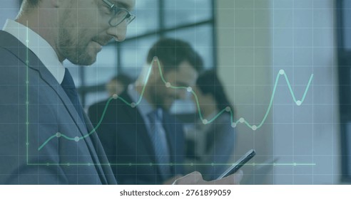 Checking left man in suit, tie, eyeglasses using smartphone in office with line chart, copy space. Corporate, business, data, analytics, visualization, collaboration, modern