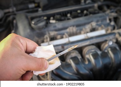 Checking The Oil Level In A Car Engine
