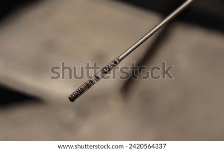 checking the oil level in the car engine. engine oil level dipstick. blurred background.