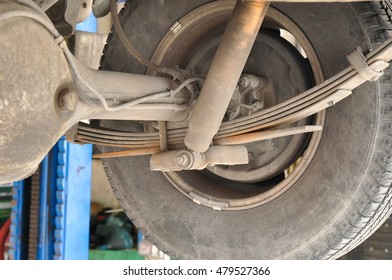 Checking Old Leaf Spring And Shock Absorber Of The Mini Truck In The Garage