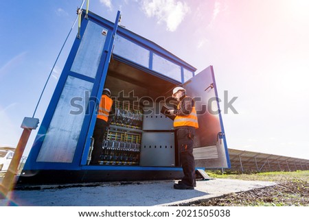 Checking the operating voltage levels of the solar panel switchgear compartment