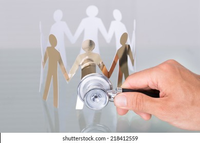 Checking Paper Cut People Using Stethoscope In Healthcare Concept