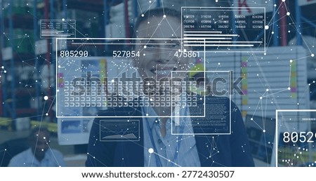 Checking stock, central manager in dark blazer overseeing warehouse monitors with HUD overlays. Logistics, fulfillment, operations, analytics, augmentedreality, dashboard, teamwork