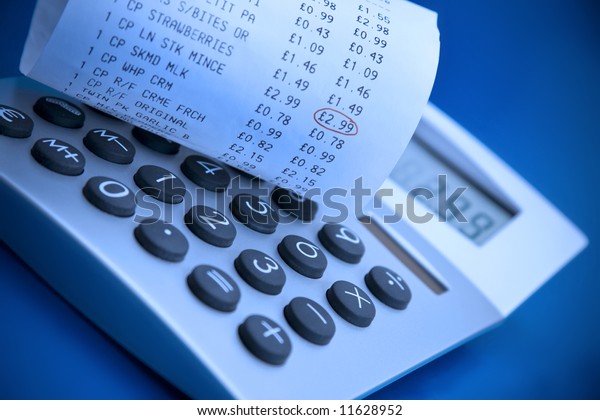 Checking supermarket cash register receipt\
with calculator
