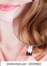 Checking Woman Hair Health By Magnifying Glass