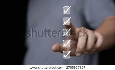 Checklist completion concept with hand selecting verified check marks, task management and quality control process. Business compliance audit, approval workflow and productivity improvement.