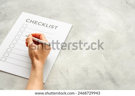 Checklist concept. Blank checklist with empty boxes on office table.