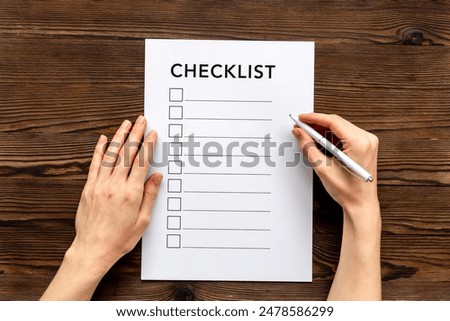 Checklist concept. Blank checklist with empty boxes on office table.