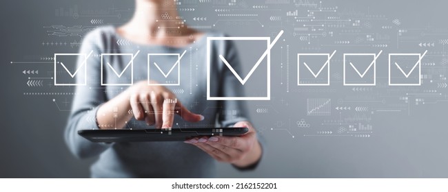 Checklist Concept With Business Woman Using A Tablet Computer