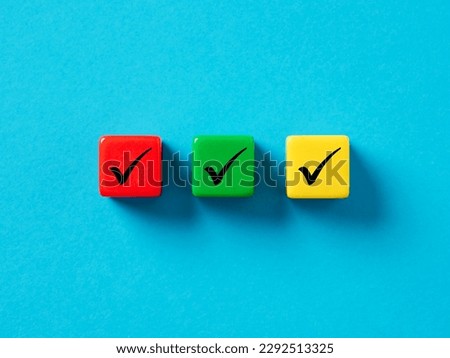 Checklist concept. Elections and Voting, Task list or task completion. Survey, and assessment concept. Check mark or tick symbols on colorful cubes.