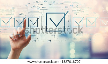 Checklist concept with hand pressing a button on a technology screen