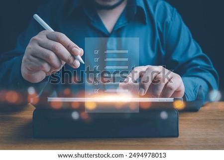 Checklist, Digital and smart checklist document concept, Businessman marking on e-checklist on virtual screen and use laptop document management with modern intelligent online systems high security.