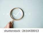 Checklist management plan. Tick answer on checkbox. Plan by check the list report and progress. A person holding a magnifying glass with a check mark on it. The check mark is surrounded by x.