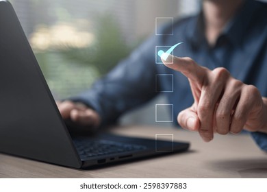 Checklist management plan. Tick answer on checkbox. Plan by check the list report and progress. A person is using a laptop with a check mark on it. The check mark is on a list of items.