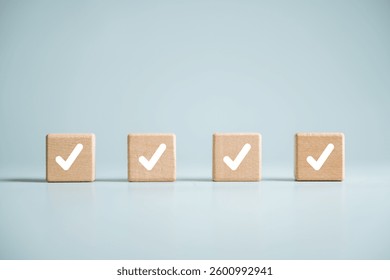 Checklist management plan. Tick answer on checkbox. Plan by check the list report and progress. Four wooden blocks with white check marks on them. The blocks are arranged in a row.