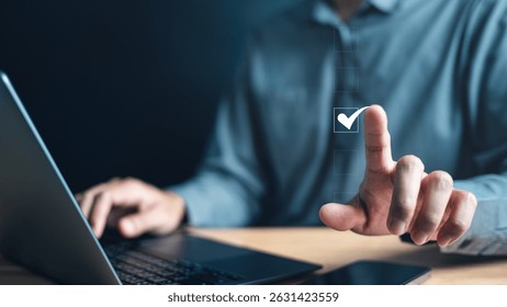 Checklist management plan. Tick answer on checkbox. Plan by check the list report and progress. A person is using a laptop and pressing a button with a check mark on it.