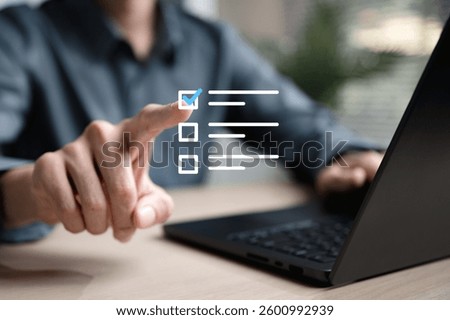 Checklist management plan. Tick answer on checkbox. Plan by check the list report and progress. A person is using a laptop computer with a blue checkmark on it.