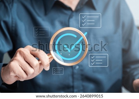 Checklist management plan. Tick answer on checkbox. Plan by check the list report and progress. A person is holding a magnifying glass over a shirt with a check mark on it.