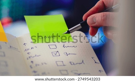 Checklist notebook completed task sticky note DONE. Hand marking finished activity task list productivity progress confirmation planning workflow organization concept