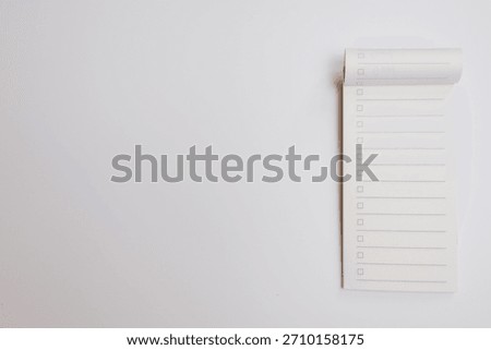 Checklist notepad with empty boxes and lines on white background, minimalistic design for task planning and organization, clean and simple layout for productivity