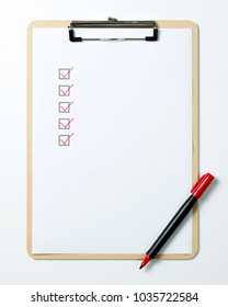 Checklist On Clipboard With A Red Pen Isolated On White Background