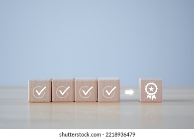 Checklist and sign of the top service Quality assurance on wooden blocks. Guarantee, Standards, ISO certification, standardization concept, advertising product and service quality commitment. 