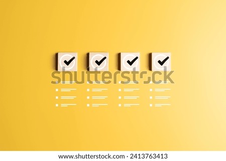 Checklist, Task list, To-do lists, Work confirmation check, or Quality Control. Goals achievement and business success. Check marks icons on wooden blocks and jobs list symbols on a yellow background.