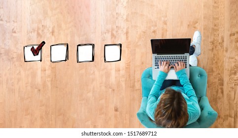 Checklist With Woman Using Her Laptop Computer