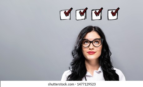 Checklist With Young Businesswoman In A Thoughtful Face