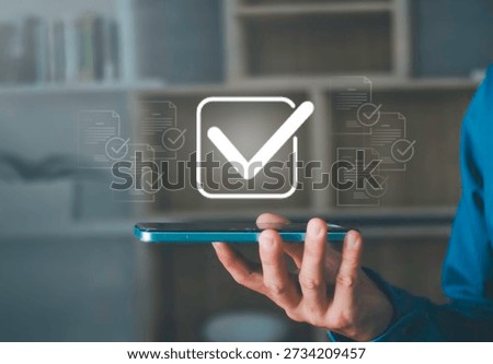 checkmark for digital approval and task completion. online procurement documents, contract warranties and licenses on mobile procurement devices for businesses and startups