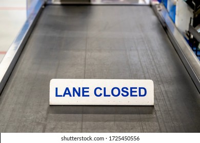 Checkout Lane Conveyor Belt At Grocery Store Has A Sign Saying It Is Closed 