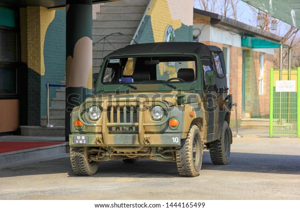 Checkpoint of Korean Demilitarized Zone (DMZ).\
South Korean army military Jeep. Military camouflage off- road car.\
Paju,South Korea ,March\
2013.