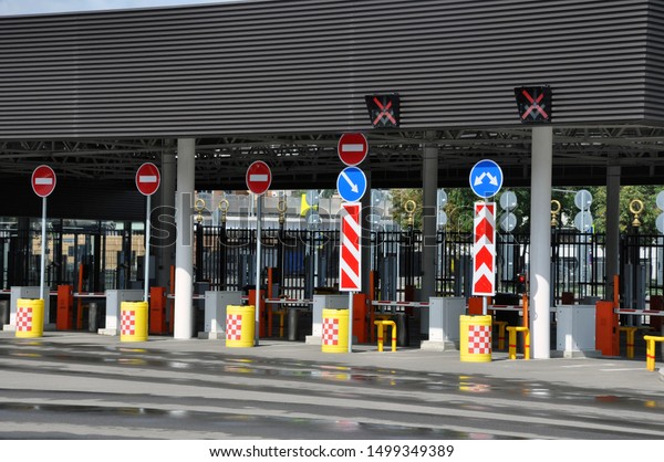 Checkpoint and parking payment in the area of a\
large football stadium.\
Barrier