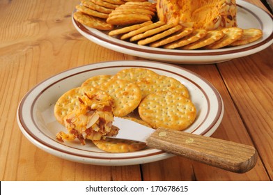 Cheddar Cheese With Almond Slices Spread On Whole Wheat Crackers